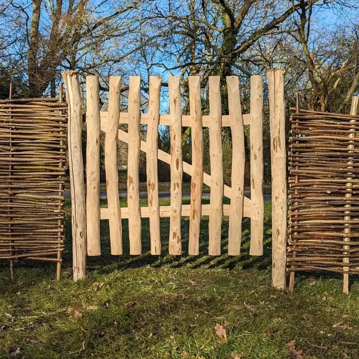 Picket gate welcoming visitors to your floral haven.