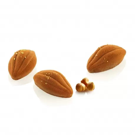 Three pecan shaped pastries on a white background
