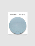 A stack of light blue circular sticky notes on a white backer card
