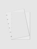 Crystal Clear Discbound Notebook Cover, CP Petite, Cloth and Paper. Two transparent notebook covers laid on top of one another with the top cover tilted slightly to the left.