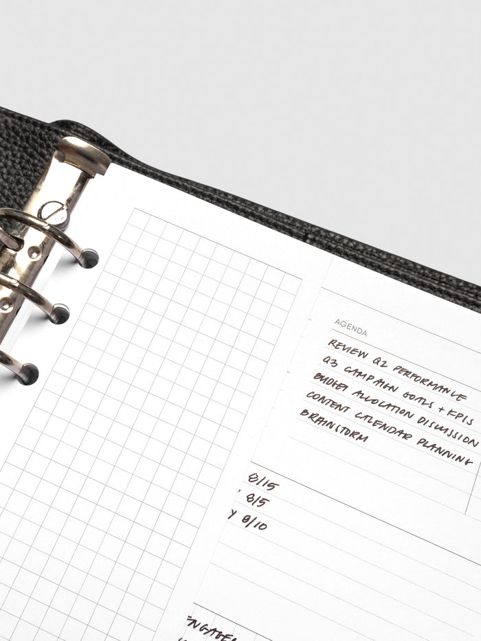 Close up of Half Page Inserts Graph inside discbound planner and leather.