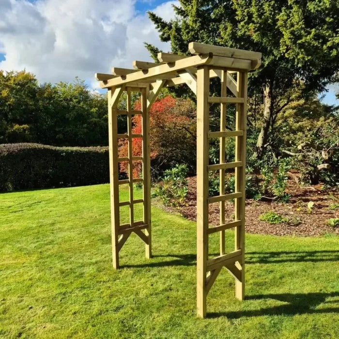 A rustic garden arch adds character to the landscape.