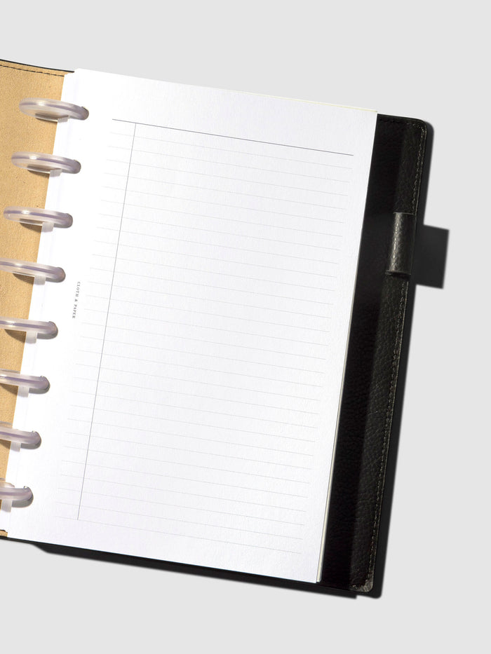 An insert staged inside a leather folio.