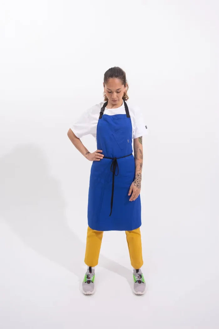 Person wearing a royal blue apron on a white background
