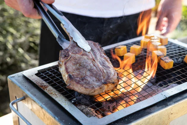 Meat being cooked over Kasai Spare Mesh on Kasai Grill.